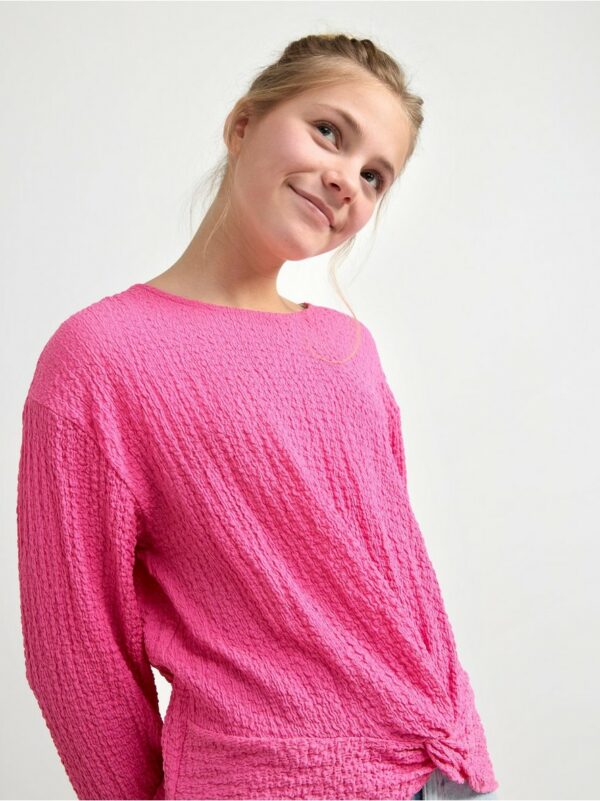 Long sleeve top with twist