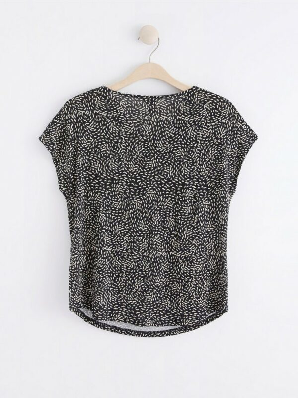 Short sleeve top with draped neckline