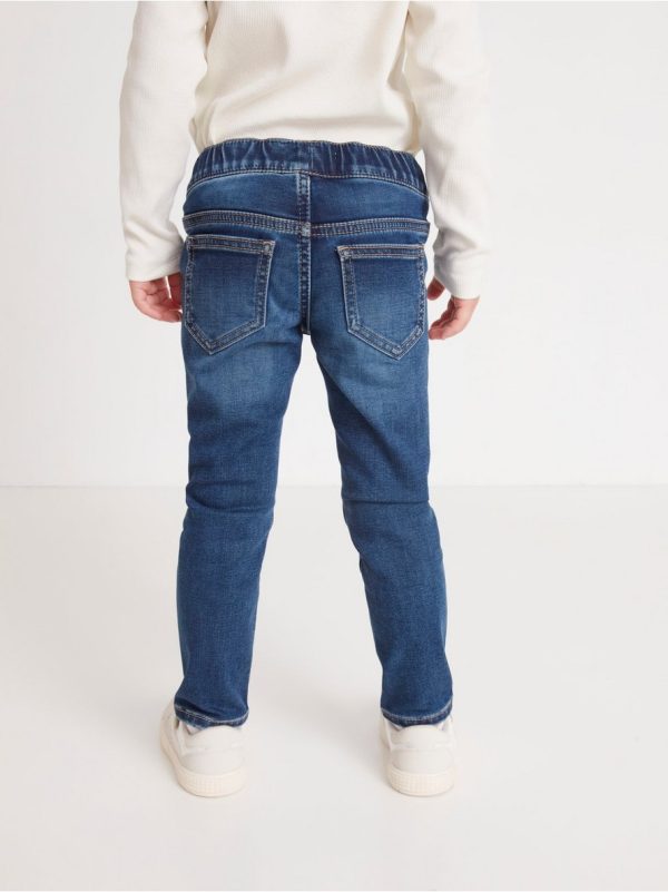 SARA Slim regular waist jeans with rhinestones