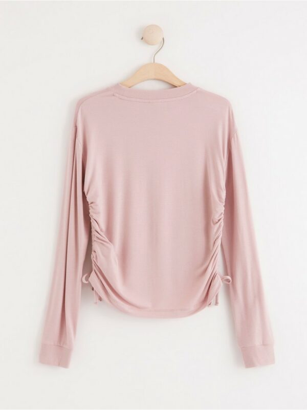 Long sleeve top with drawstring