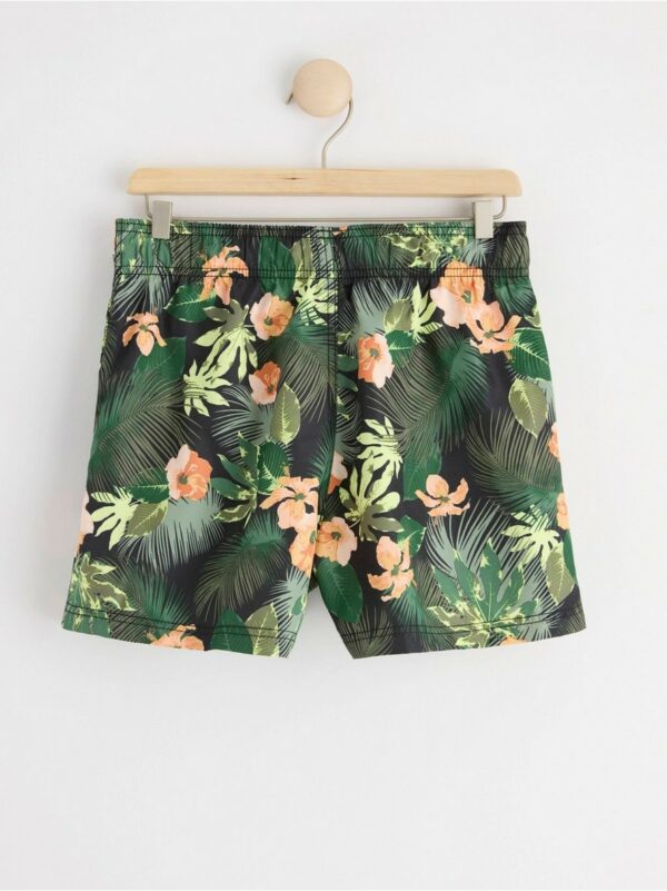 Swim shorts with tropical pattern