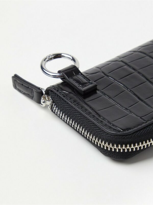 Wallet with crocodile pattern